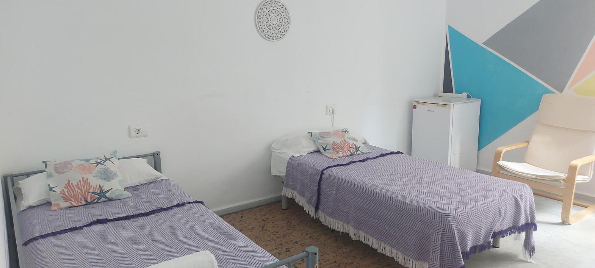 Quarto Standard com 2 Camas de Solteiro e Banheiro Compartilhado